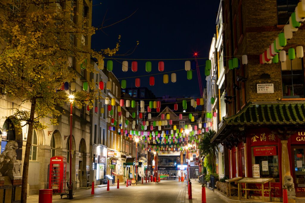 pexels-photo-6069355-6069355 Colorful lanterns illuminate a Chinatown street, capturing a lively night scene.